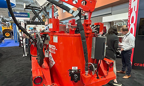 Caterpillar exhibit and big crowd of people at World of Asphalt