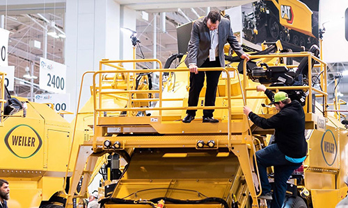 Asphalt paving team at work on the road