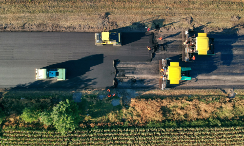 Overhead road paving