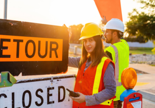 Woman asphalt crew working on jobsite